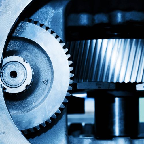 A close-up of gear in a machine used for factory automation maintenance and Industrial Repair Services.