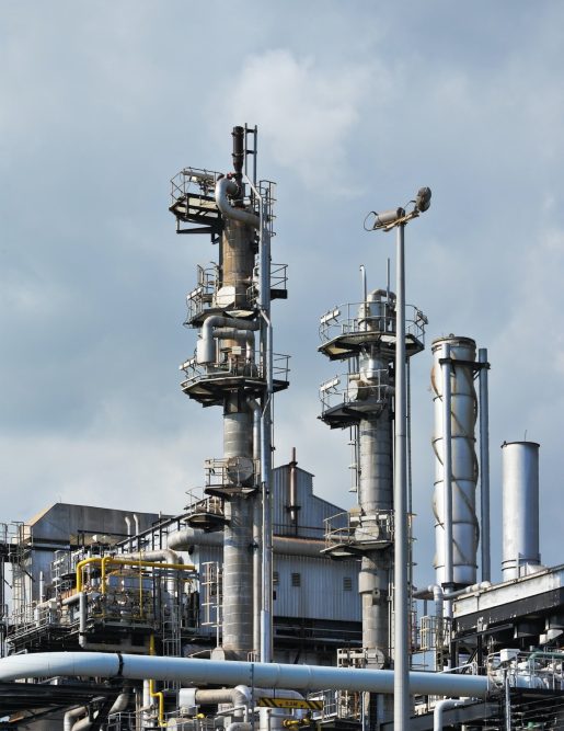 An oil refinery with many pipes and industrial automation.